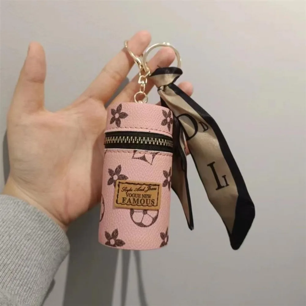 Monogram Keychain Leather - Bolsa cilíndrica mini para lápiz labial